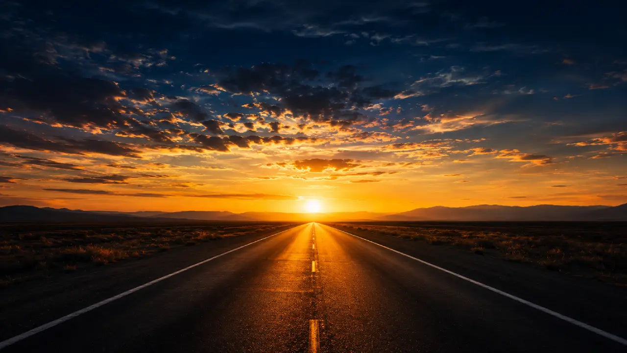 A single straight empty road stretching to the horizon at dawn with no distractions on either side, symbolising discipline as a pre-decided path